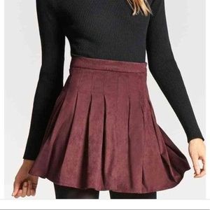 Maroon pleated faux Swede skirt.